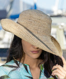 Model wearing Model wearing Leor crochet straw hat handmade natural straw color raffia 3" brim packable straw hat - Shebobo
