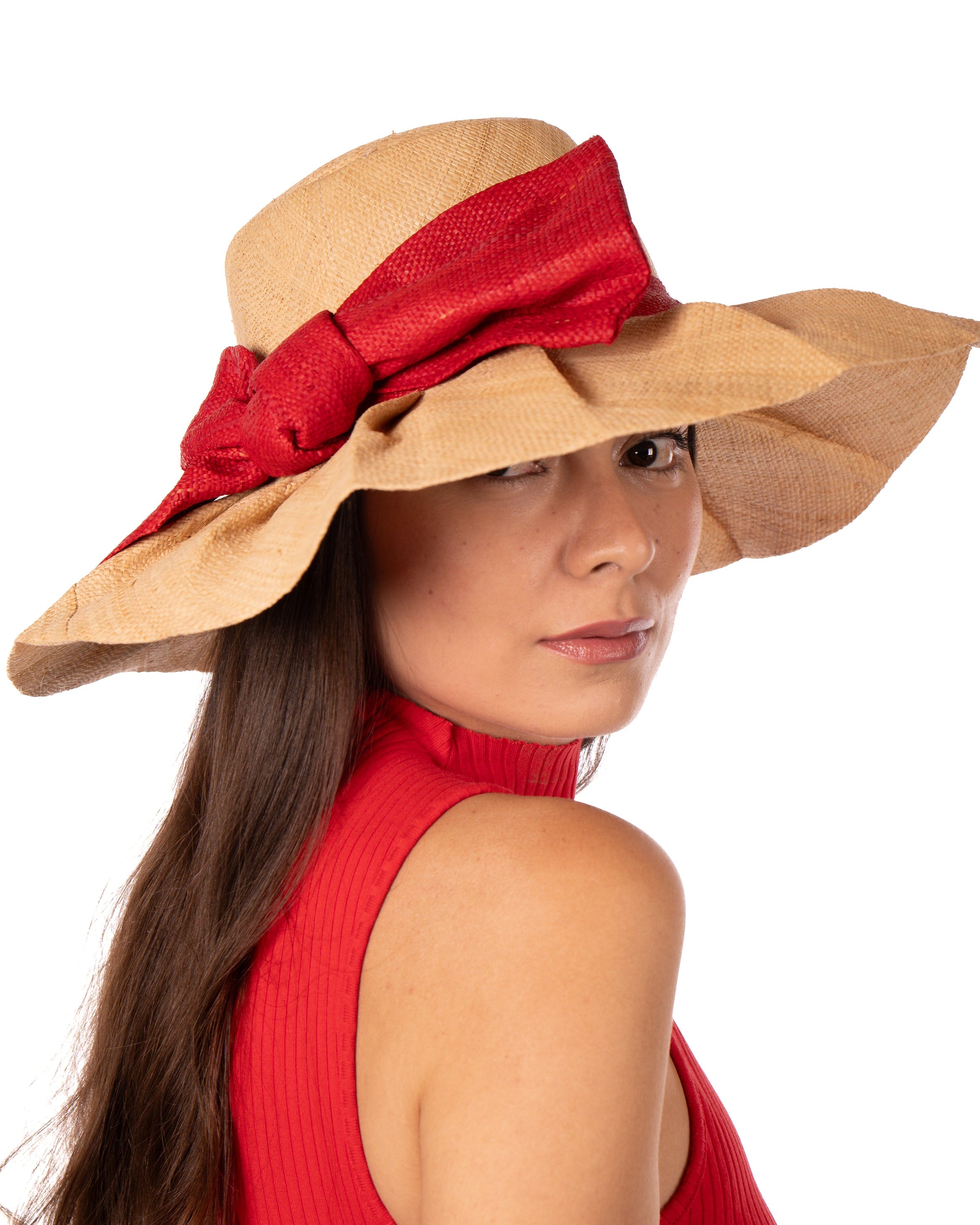 Model wearing Lilly 5" Brim Fan Straw Sun Hat with Big Red  bow and matching hatband on handmade natural loomed raffia pleated wide brim hat - Shebobo