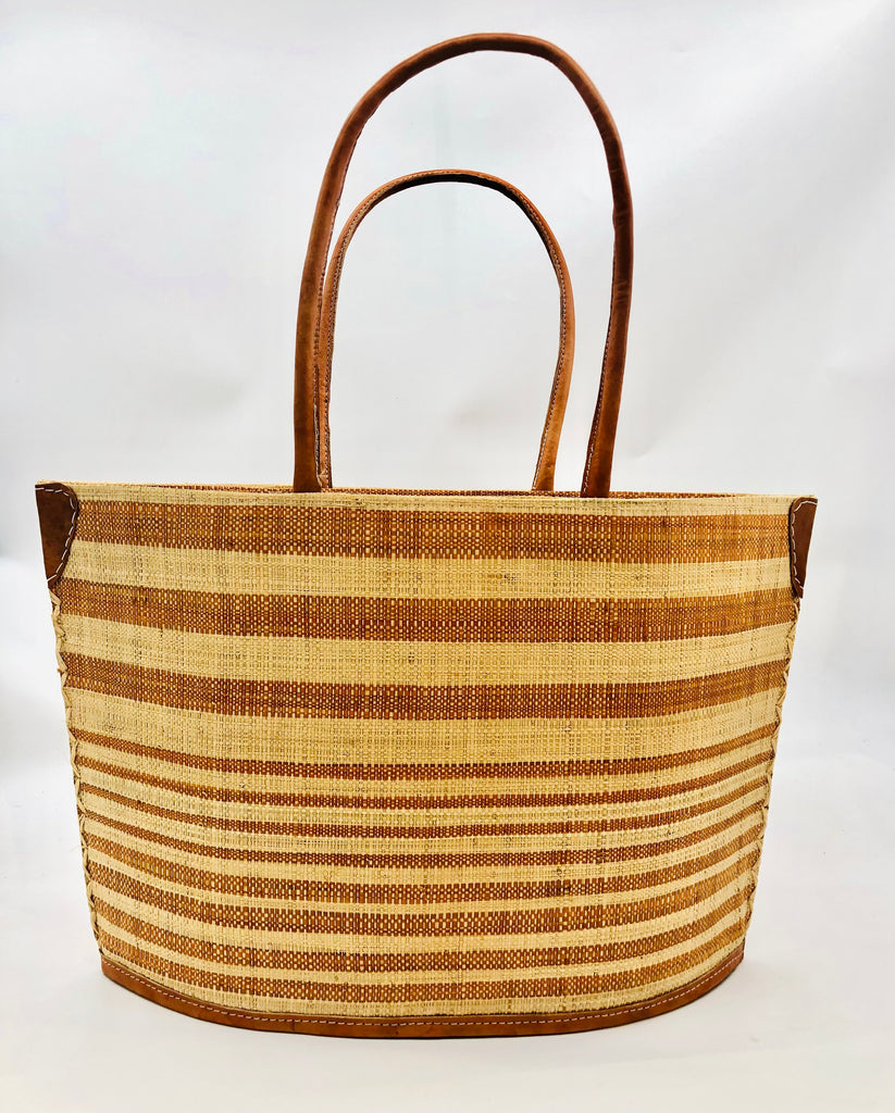 Lova Wide Stripe Straw Tote Bag handmade loomed raffia in varying widths of horizontal stripes in caramel brown, and natural straw color handbag beach bag with leather handles - Shebobo