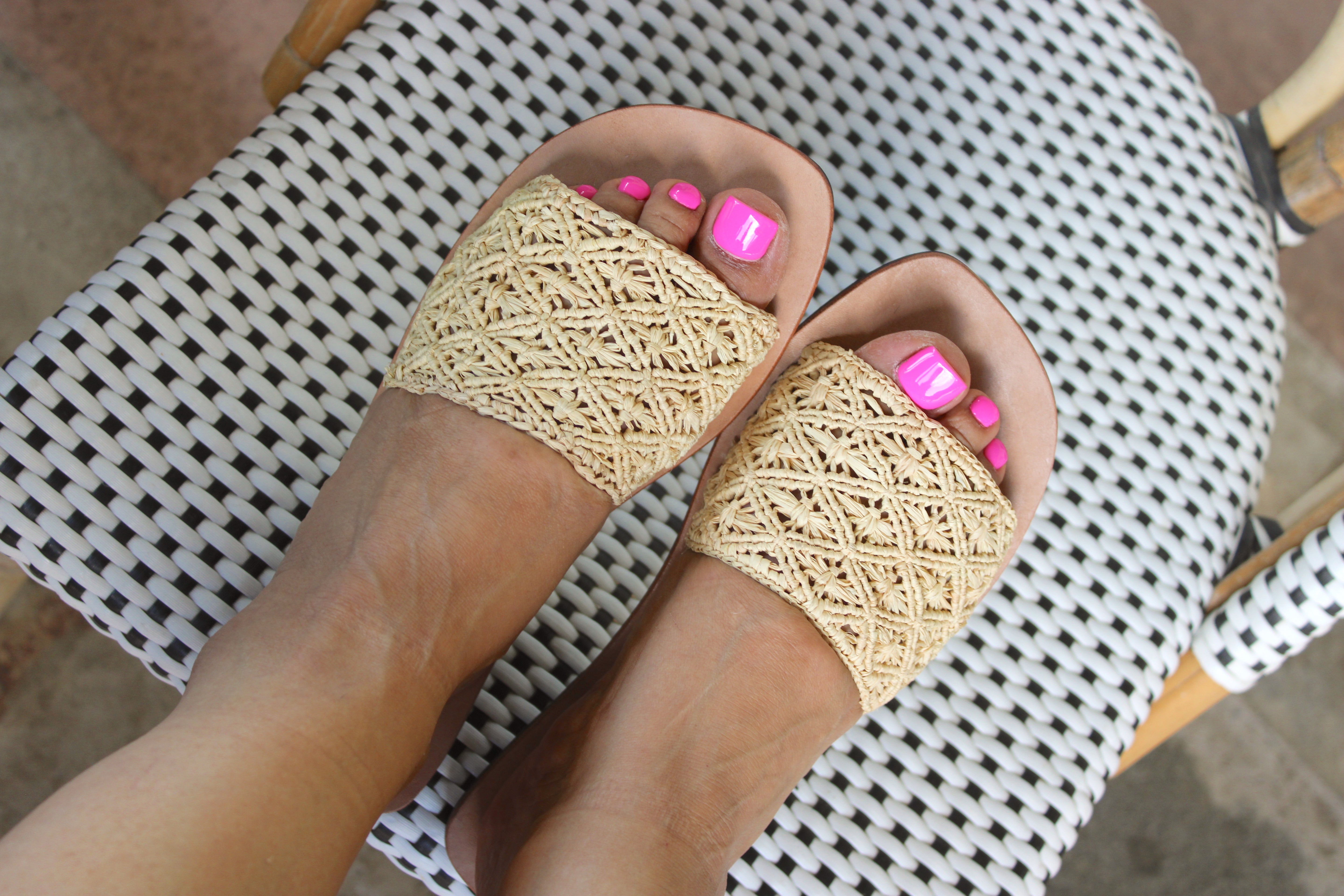 Model wearing Lulu Macrame and Crochet Diamond Straw Sandal Shoes handmade natural raffia palm fiber crochet and knotted macrame in a solid hue of natural straw color with geometric diamond or flower pattern in diagonal bands of texture on the top of the shoe and leather with rubber anti slip soles slide sandals - Shebobo