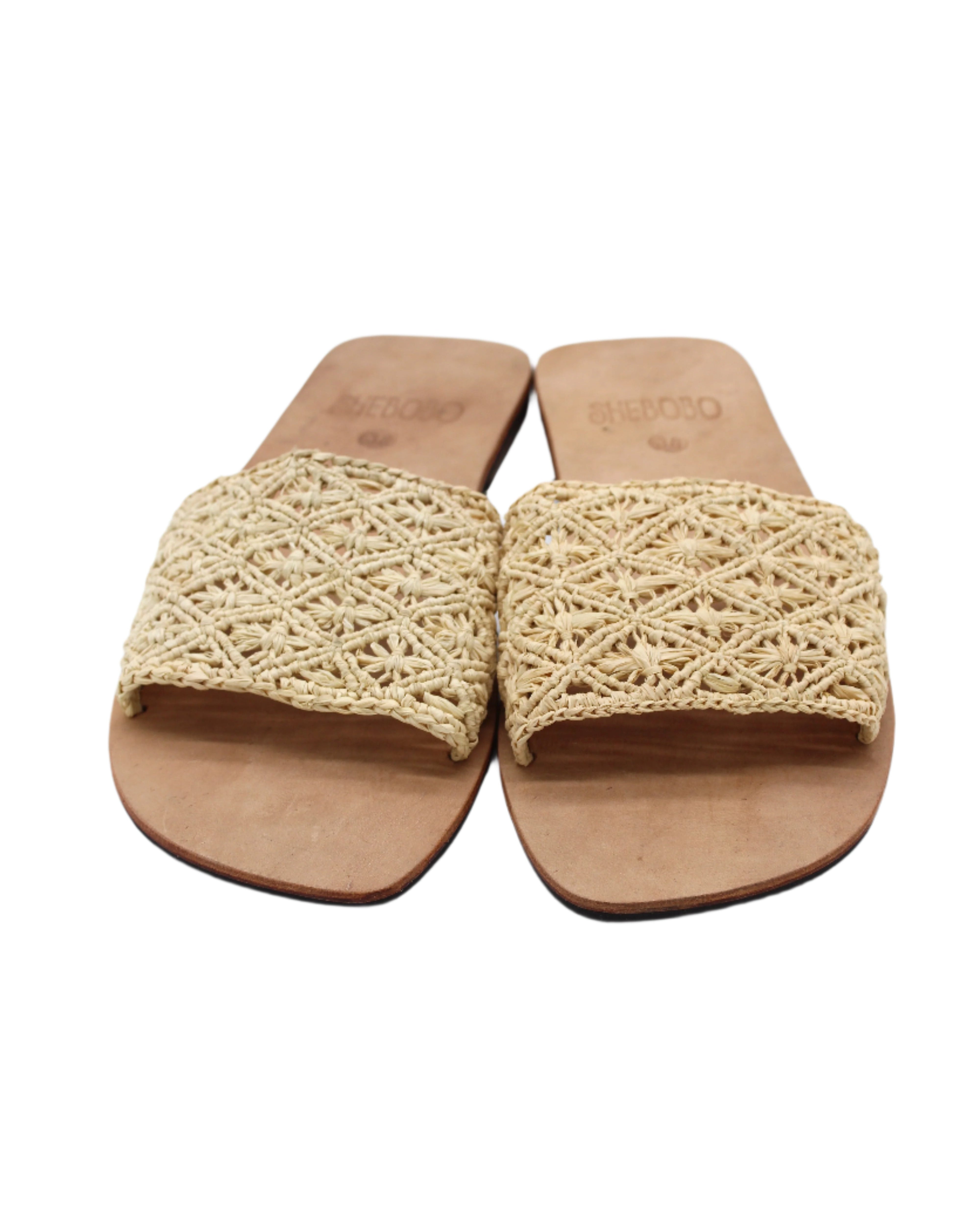 Front view Lulu Macrame and Crochet Diamond Straw Sandal Shoes handmade natural raffia palm fiber crochet and knotted macrame in a solid hue of natural straw color with geometric diamond or flower pattern in diagonal bands of texture on the top of the shoe and leather with rubber anti slip soles slide sandals - Shebobo