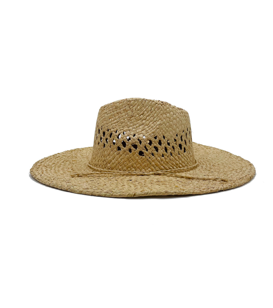 Side View Macho Natural Unisex Straw Cowboy Hat with Adjustable Wire Rim handmade woven raffia in a solid hue of natural straw color in a structured crown style with negative space for breathability and pliable wire rim with matching twisted cord hat band - Shebobo