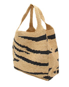 Side view Mamie XL Crochet Straw Basket Handbag handmade crochet natural raffia palm fiber in a two tone natural straw color and black zebra stripe pattern purse beach bag - Shebobo