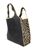 Side view Mamie Zigzag Pinstripe XL Crochet Straw Basket Handbag handmade crochet natural raffia palm fiber in a solid hue of black purse beach bag with contrasting natural straw color zigzag pinstripe pattern on the sides of the bag and matching outer edge - Shebobo
