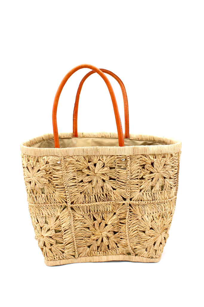 Marie Flower Crochet Straw Basket Bag handmade natural raffia palm fiber woven into a geometric grid of squares with a central flower per square similar to a granny square pattern handbag tote with leather handles - Shebobo