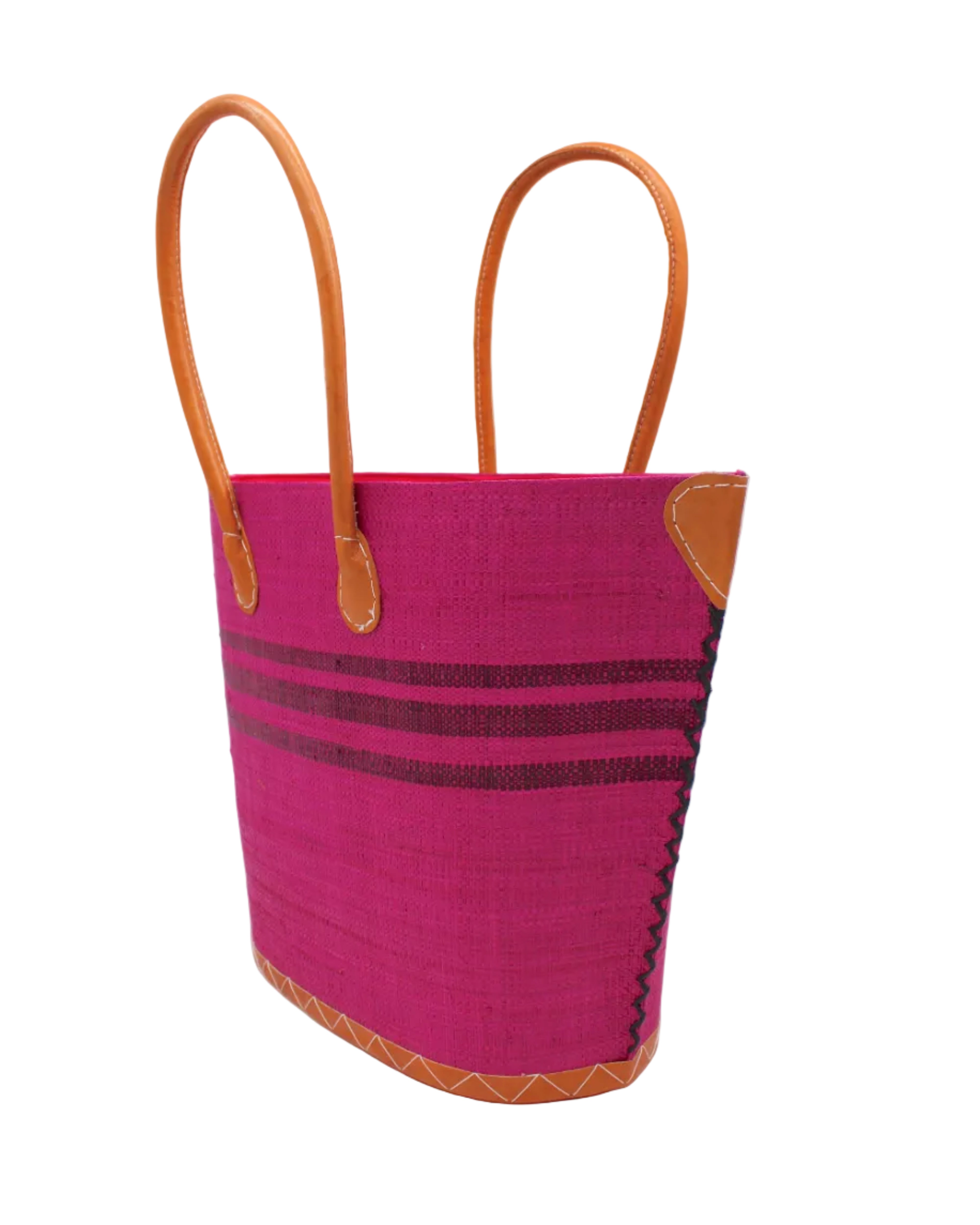 Side view Marina Racing Stripe Small Straw Tote Bag handmade loomed natural raffia palm fiber in a solid hue of Fuchsia hot/bright/barbie/pink with three horizontal bands of umberwine burgundy/dark/red/purple making a pinstripe pattern across the top third of the bag with matching cross-stitch edging, leather handles and accents beach bag handbag - Shebobo 