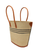 Side view Marina Racing Stripe Small Straw Tote Bag handmade loomed natural raffia palm fiber in a solid hue of natural straw color with three horizontal bands of black making a pinstripe pattern across the top third of the bag with matching cross-stitch edging, leather handles and accents beach bag handbag - Shebobo 