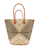 Mariposa Large Straw Tote Bag handmade loomed natural raffia palm fiber in a multi paneled pattern design of pinstripe, melange, and wide stripe combinations geometrically radiating from the center point of the bag outwards in a two tone color combination of Natural straw color and black with a solid hue of color on the back of the bag plus leather handles and embellishments shoulder bag - Shebobo