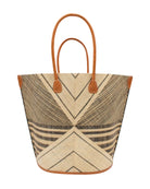 Mariposa Large Straw Tote Bag handmade loomed natural raffia palm fiber in a multi paneled pattern design of pinstripe, melange, and wide stripe combinations geometrically radiating from the center point of the bag outwards in a two tone color combination of Natural straw color and black with a solid hue of color on the back of the bag plus leather handles and embellishments shoulder bag - Shebobo