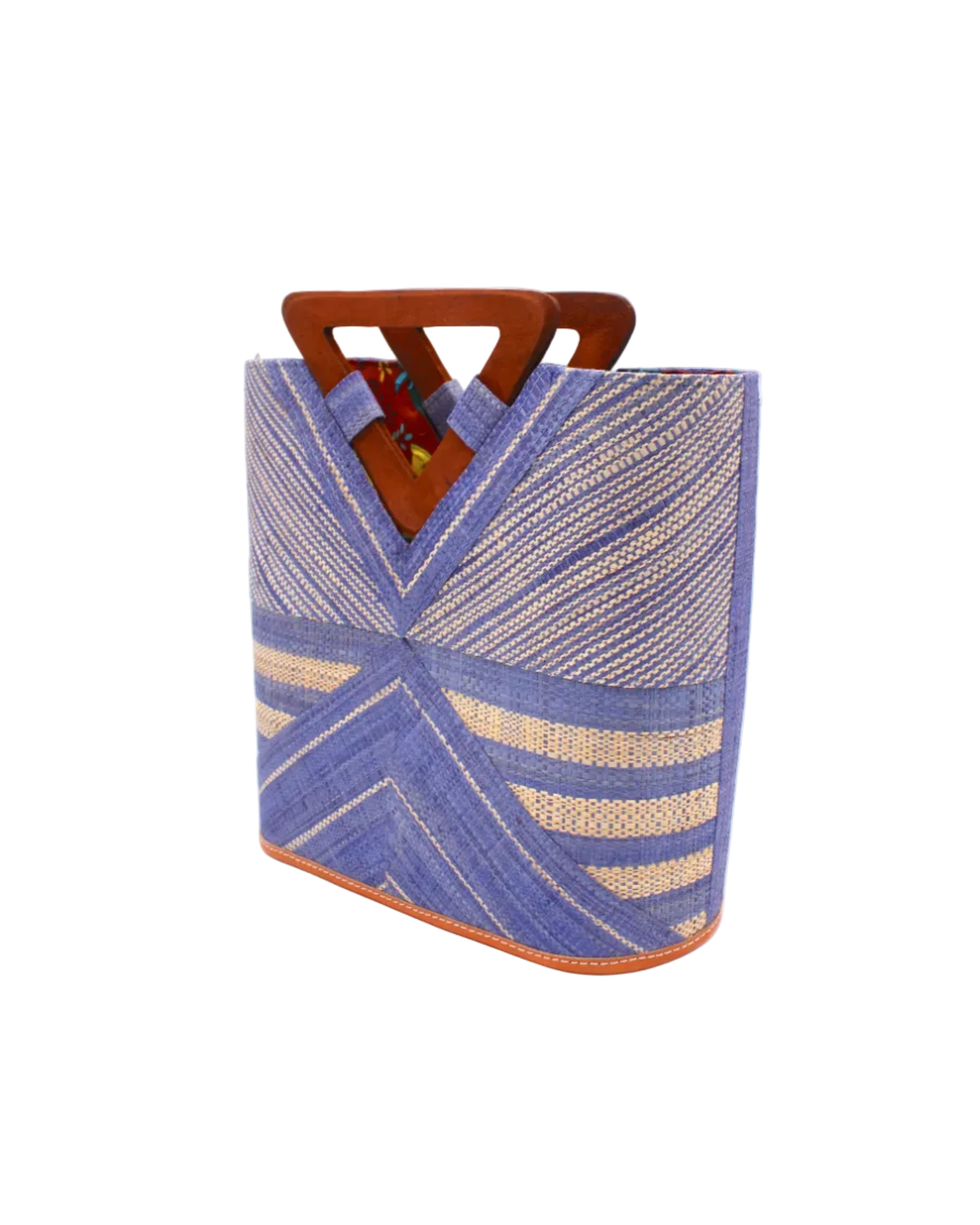 Side view Mariposa Zuki Raffia Straw Bucket Handbag with Wood Triangle Handles  handmade loomed raffia palm fiber in a multi paneled pattern design of pinstripe, melange, and wide stripe combinations geometrically radiating from the center point of the bag outwards in a two tone color combination of Denim and Natural straw color with a solid hue of color on the back of the bag plus carved wooden handles purse - Shebobo