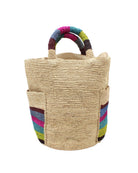 Milos Riviera Stripes Crochet Straw Basket Handbag with Pockets handmade natural raffia palm fiber in a solid hue of natural straw color on the body of the bag with multicolor wide stripe pattern of umberwine bordeaux/claret/deep/dark/red/purple, denim retro/light/blue, fuchsia hot/bright/barbie/pink, teal dark/blue/green, midori lime/neon/green, and black on both handles as well as two large external pockets tote bag - Shebobo