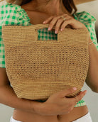 Model wearing Mini ConCon Crochet Straw Basket - Petite Crochet Bag handmade natural raffia palm fiber woven handbag - Shebobo