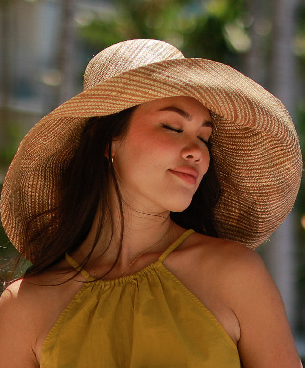 Model wearing 5 inch or 7 inch Wide Brim Cinnamon Two Tone Melange Packable Straw Sun Hat handmade loomed raffia in a multicolor heathered melange pattern of cinnamon/tobacco/brown and natural straw color creates a subtle swirl - Shebobo