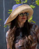 Model wearingMonica  7" Brim Two Tone Denim Straw Hat handmade loomed raffia color block pattern of the top half denim retro/light/blue and the bottom half natural straw color - Shebobo
