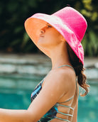 Mode wearing Monica 5" wide brim handmade fuchsia hot/bright/barbie/pink half and natural straw color bottom half two tone loomed raffia sun protection packable lightweight straw hat - Shebobo