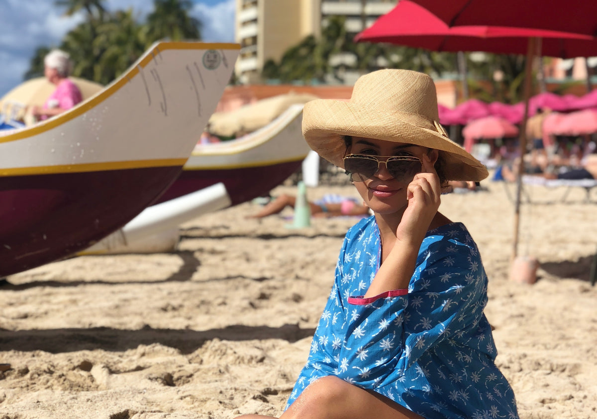 Model wearing Monica 5" Wide Brim Solid Color Packable Straw Sun Hats handmade loomed natural raffia palm fiber in a solid hue of natural straw color lightweight, packable, breathable, uv protection hat - Shebobo