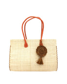 Monte Carlo Big Straw Beach Bag with Dreamcatcher Tassel Charm Embellishment handmade loomed raffia palm fiber in a solid hue of natural straw color with contrasting crosshatch stitch edging in cinnamon/tobacco/dark/brown with matching crochet dreamcatcher disc and tuft tassel charm embellishment and leather handles oversized large handbag shoulder bag - Shebobo