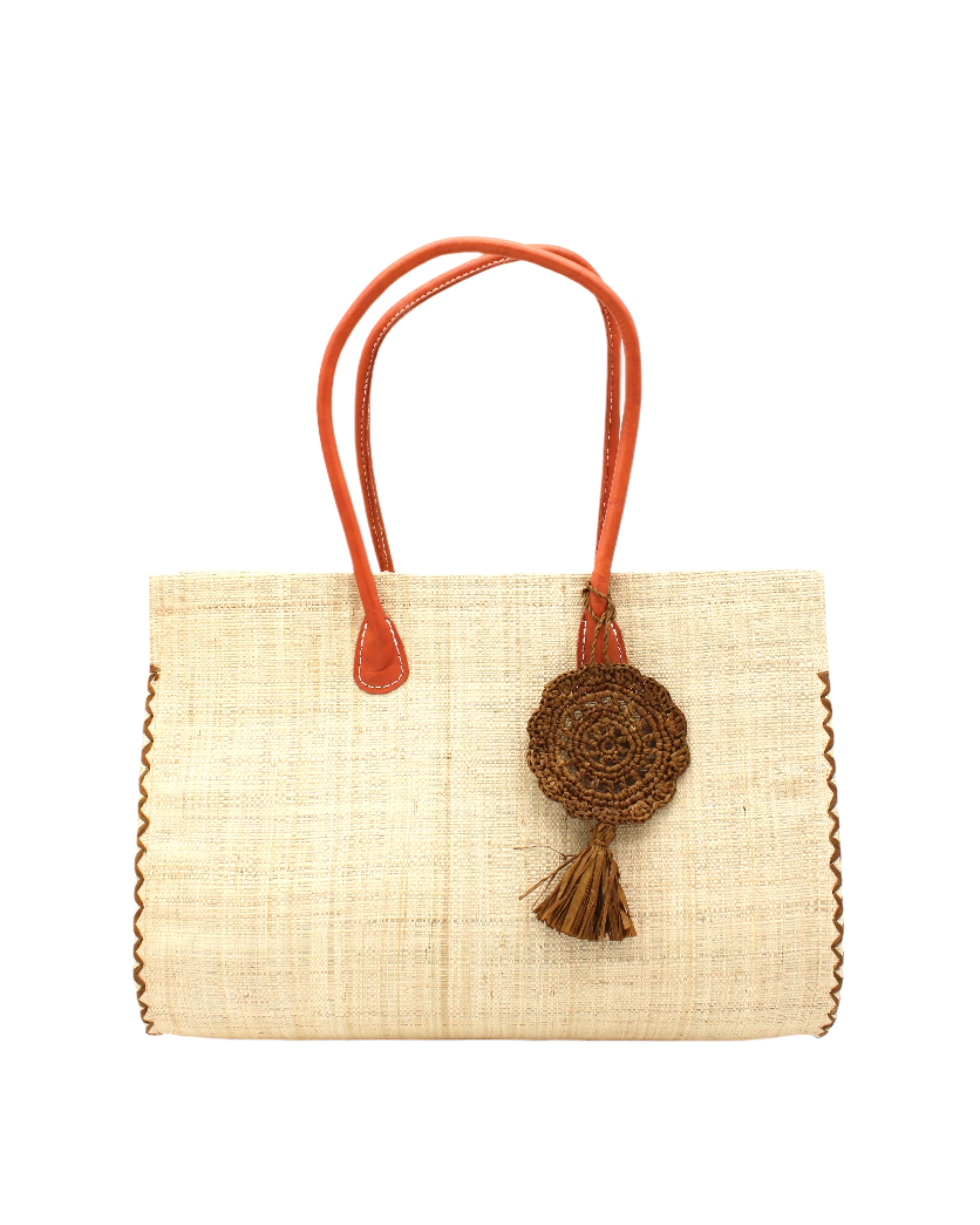 Monte Carlo Big Straw Beach Bag with Dreamcatcher Tassel Charm Embellishment handmade loomed raffia palm fiber in a solid hue of natural straw color with contrasting crosshatch stitch edging in cinnamon/tobacco/dark/brown with matching crochet dreamcatcher disc and tuft tassel charm embellishment and leather handles oversized large handbag shoulder bag - Shebobo