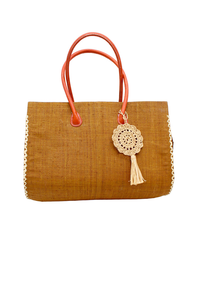 Monte Carlo Big Straw Beach Bag with Dreamcatcher Tassel Charm Embellishment handmade loomed raffia palm fiber in a solid hue of cinnamon tobacco/dark/brown with contrasting crosshatch stitch edging in natural straw color with matching crochet dreamcatcher disc and tuft tassel charm embellishment and leather handles oversized large handbag shoulder bag - Shebobo