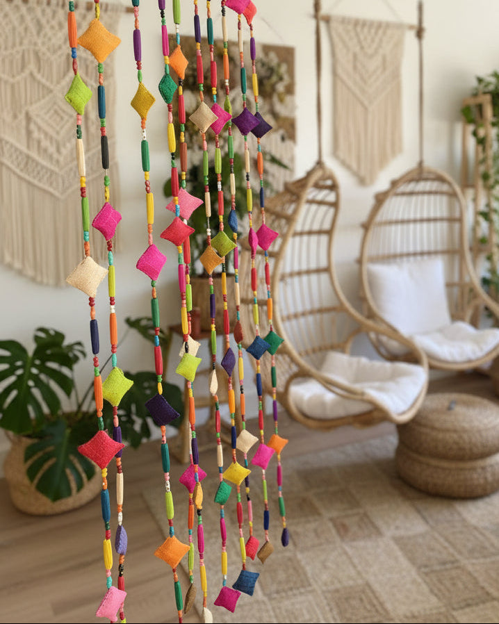 Zola Garland Multicolor Raffia Pillow Bead Strands Room Decor Festive beaded strands of handmade loomed raffia pillow beads, hand wrapped long raffia loop beads, and painted plastic beads in bright, bold, fun colors (sold as single strand or pack of 10 Strands) - Shebobo