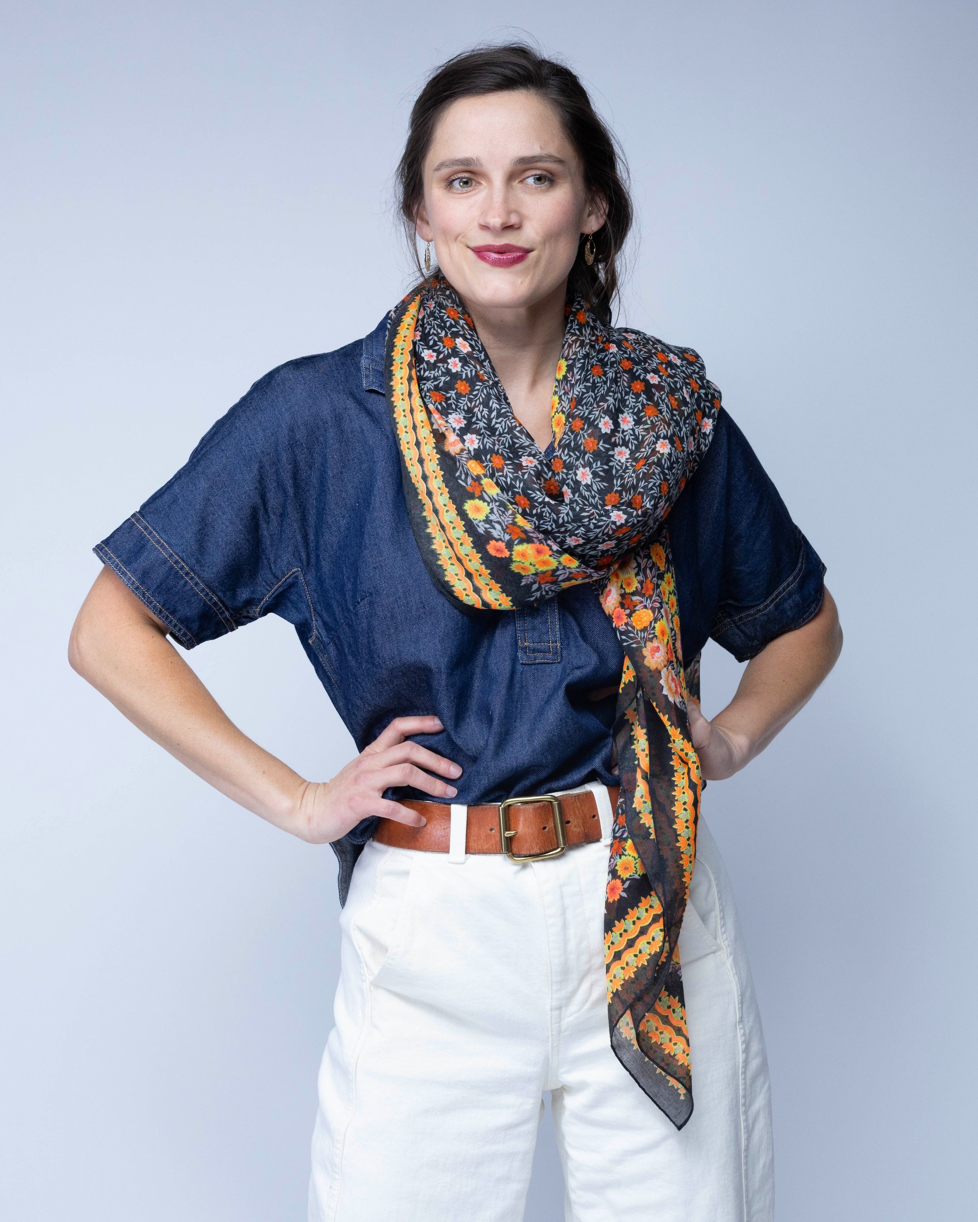 Model wearing Sweet Meadow Scarf Wrap Orange Multicolor Floral Pattern with black, white, orange, yellow, etc. - Shebobo