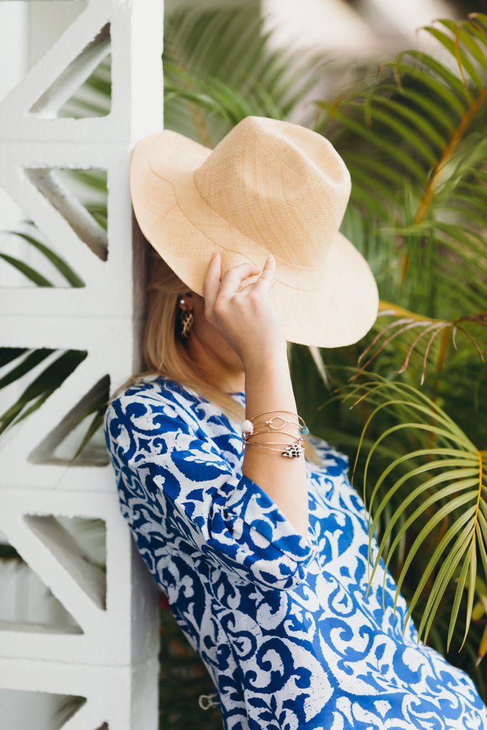 Model wearing Panama Natural unisex straw hat handmade loomed raffia 3" brim sun hat - Shebobo