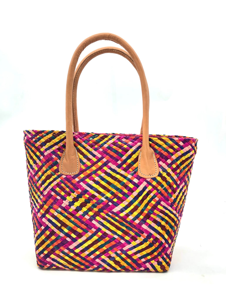 Pianina Raspberry Multi Small Straw Basket Bag handmade from woven natural raffia palm fiber in a multicolor cross weave pattern of turquoise blue, coral orange, orchid purple, bordeaux red, fuchsia pink, light pink, saffron yellow, yellow, and navy blue handbag purse with leather handles - Shebobo