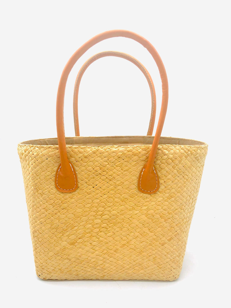 Pianina Natural Small Straw Basket Bag handmade from woven natural raffia palm fiber in a monochromatic cross weave pattern of natural straw color handbag purse with leather handles - Shebobo