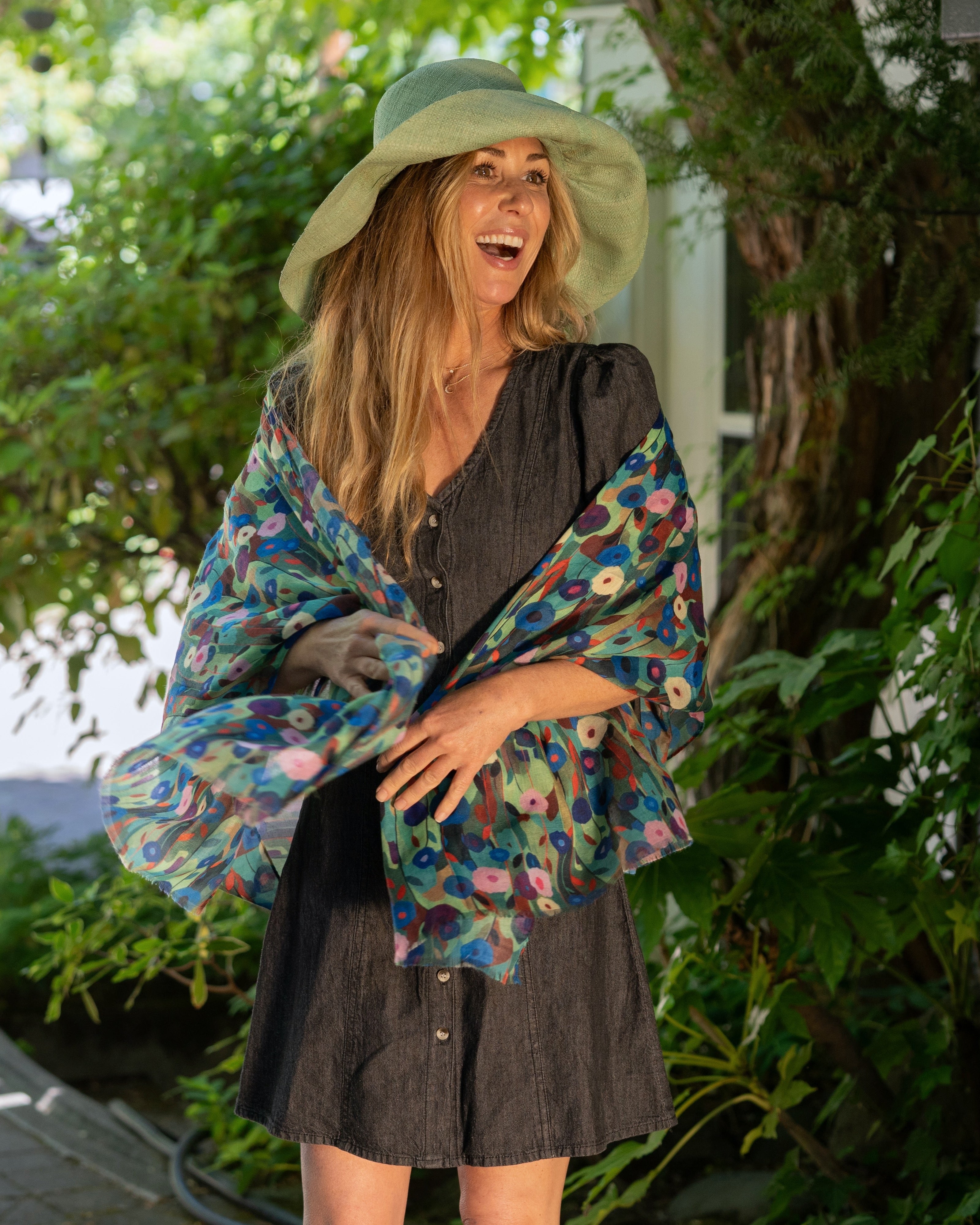 Model wearing Poppy Dreams Scarf Wrap Green with multicolored floral patterned scarf - Shebobo (with Monica 5" & 7" Wide Brim Solid Color Packable Straw Sun Hats)