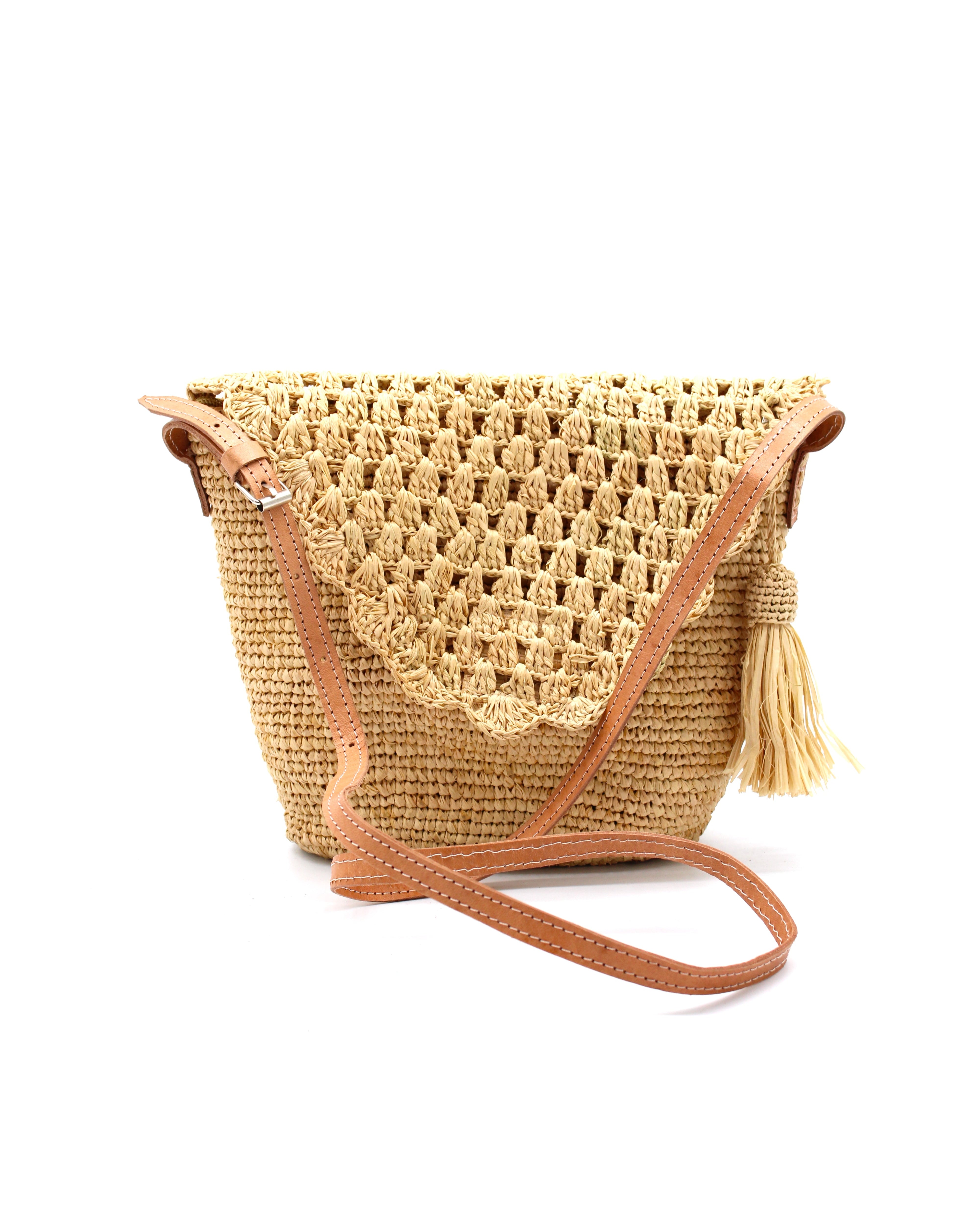 Portola Crochet Straw Crossbody Bag with Tassel Zipper Pull handmade woven natural raffia palm fiber in a solid hue of natural straw color with multiple crochet textures, knotted tassel zipper pull, and adjustable leather shoulder strap - Shebobo