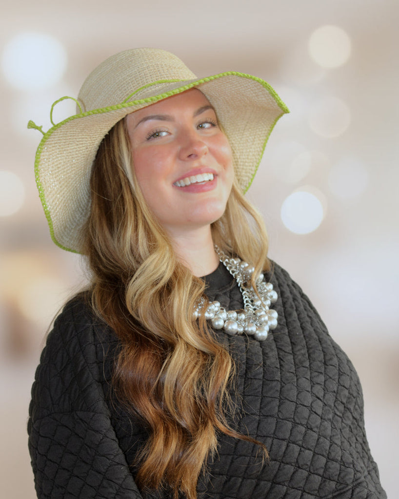 Model wearing 4 inch brim Rachel Crochet Midori handmade straw sun hat midori lime/bright/neon/green trim woven edge and matching adjustable hat band on natural straw colored raffia hat - Shebobo