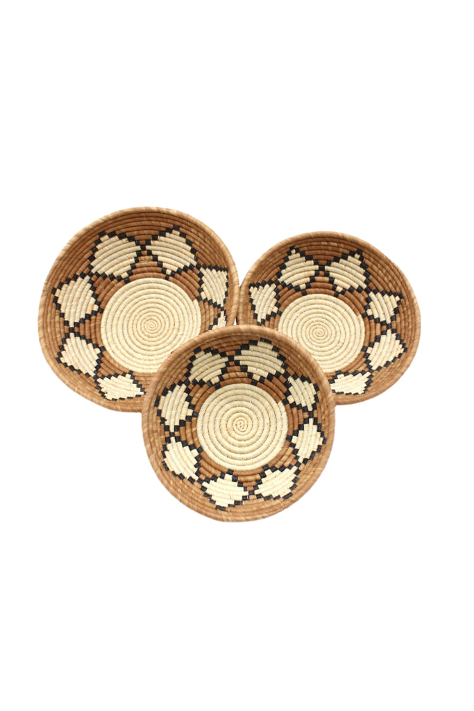 Raffia Straw Decor Display Basket Bowls: Set of 3 handmade woven natural raffia palm fiber in a crochet loop technique concentric coiled circular pattern with natural straw color centered in the bottom with cinnamon/tobacco/brown sides and natural diamond with black edges pattern set of small, medium, and large straw display bowls - Shebobo