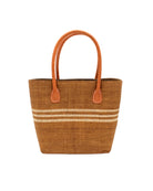 Raja Racing Stripe Straw Basket Bag handmade loomed natural raffia palm fiber in a two tone multicolor design of Tobacco cinnamon/dark/brown color with three horizontal bands of Natural straw color creating a racing stripe pattern placed under the base of the handles a third down the height of the bag - Shebobo