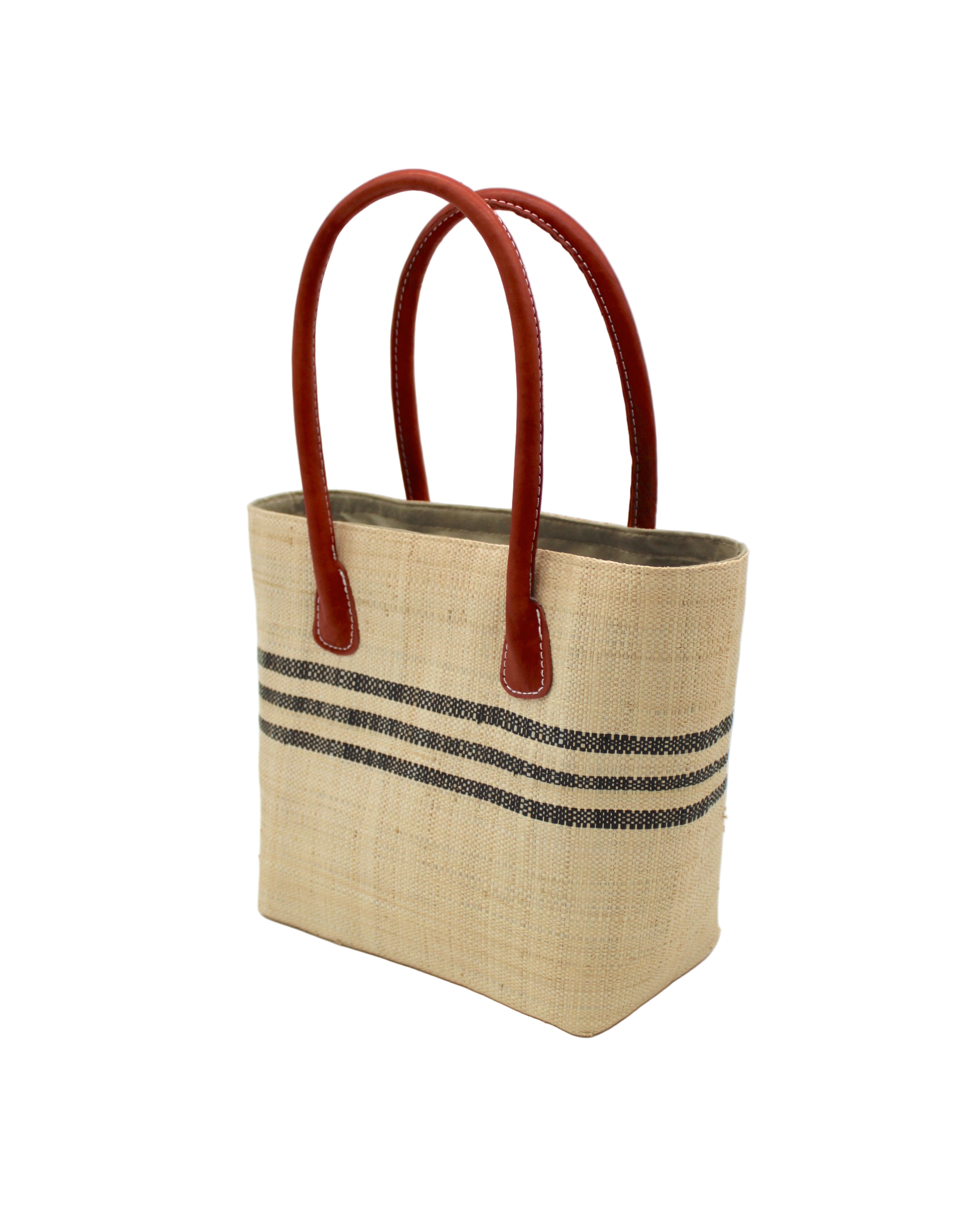 Side view Raja Racing Stripe Straw Basket Bag handmade loomed natural raffia palm fiber in a two tone multicolor design of Natural straw color with three horizontal bands of Black creating a racing stripe pattern placed under the base of the handles a third down the height of the bag - Shebobo