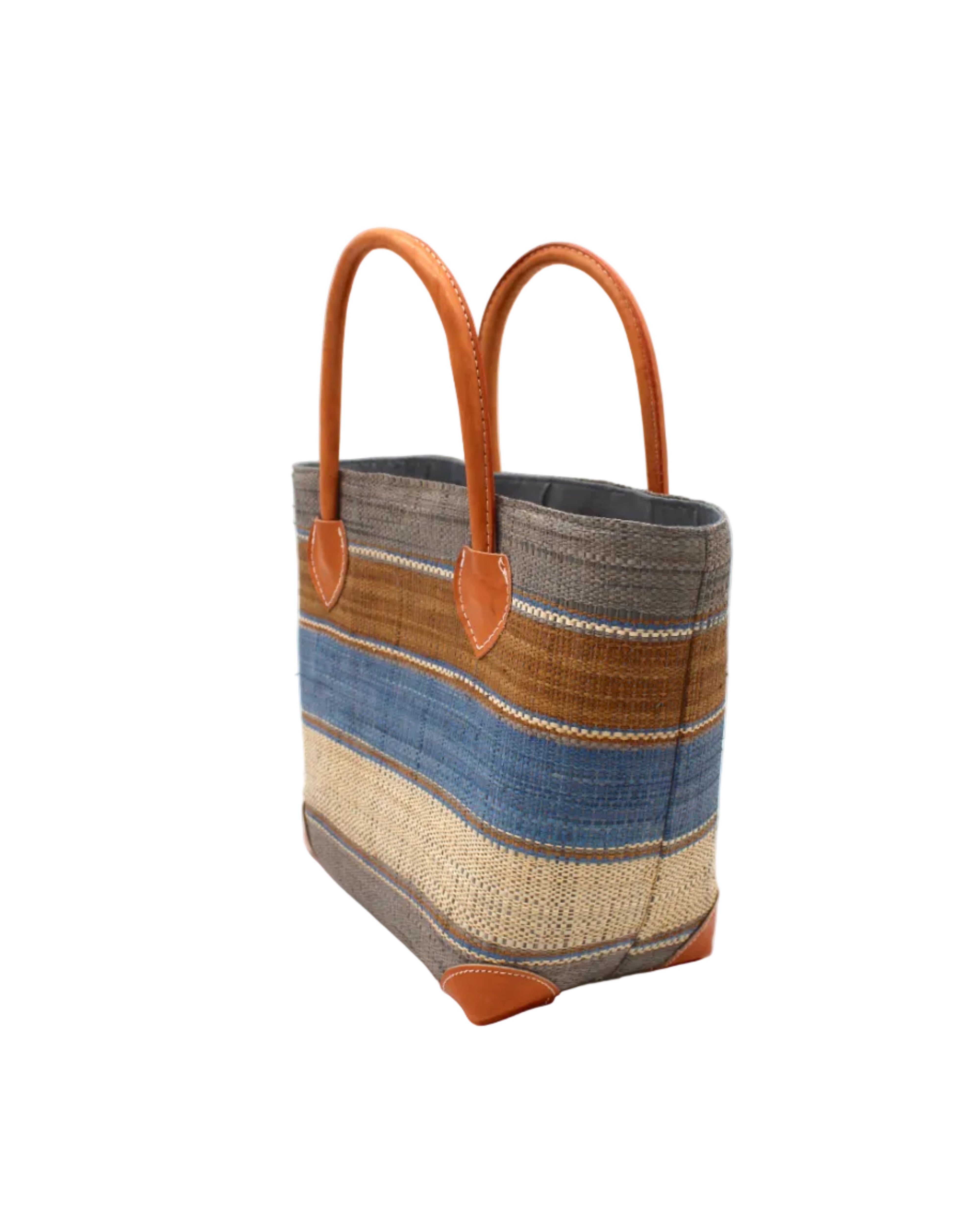 Side view Rayo Stripes Straw Basket Bag Tobacco Swirl handmade loomed natural raffia palm fiber in a multicolor multi width horizontal stripe pattern of grey, tobacco cinnamon/dark/brown, denim retro/light/blue and natural straw color with leather handles and accents tote beach bag - Shebobo