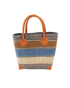 Rayo Stripes Straw Basket Bag Tobacco Swirl handmade loomed natural raffia palm fiber in a multicolor multi width horizontal stripe pattern of grey, tobacco cinnamon/dark/brown, denim retro/light/blue and natural straw color with leather handles and accents tote beach bag - Shebobo