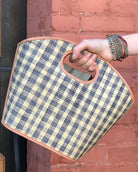 Model wearing Ricky Grey Gingham Straw Bucket Handbag handmade loomed raffia purse grey and natural straw color plaid pattern bag - Shebobo