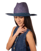 Model wearing Riley 3" Brim Panama Unisex Two Tone Straw Hats handmade loomed raffia palm fiber in a solid hue of denim retro/light/blue on the crown and solid turquoise blue/green on the brim with matching attached hat band lightweight breathable uv/sun protection straw sun hat - Shebobo