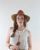 Model wearing Riley 3" Brim Panama Unisex Two Tone Straw Hats handmade loomed raffia palm fiber in a solid hue of cinnamon/tobacco/dark/brown on the crown and solid whisky caramel/red/brown on the brim with matching attached hat band lightweight breathable uv/sun protection straw sun hat - Shebobo