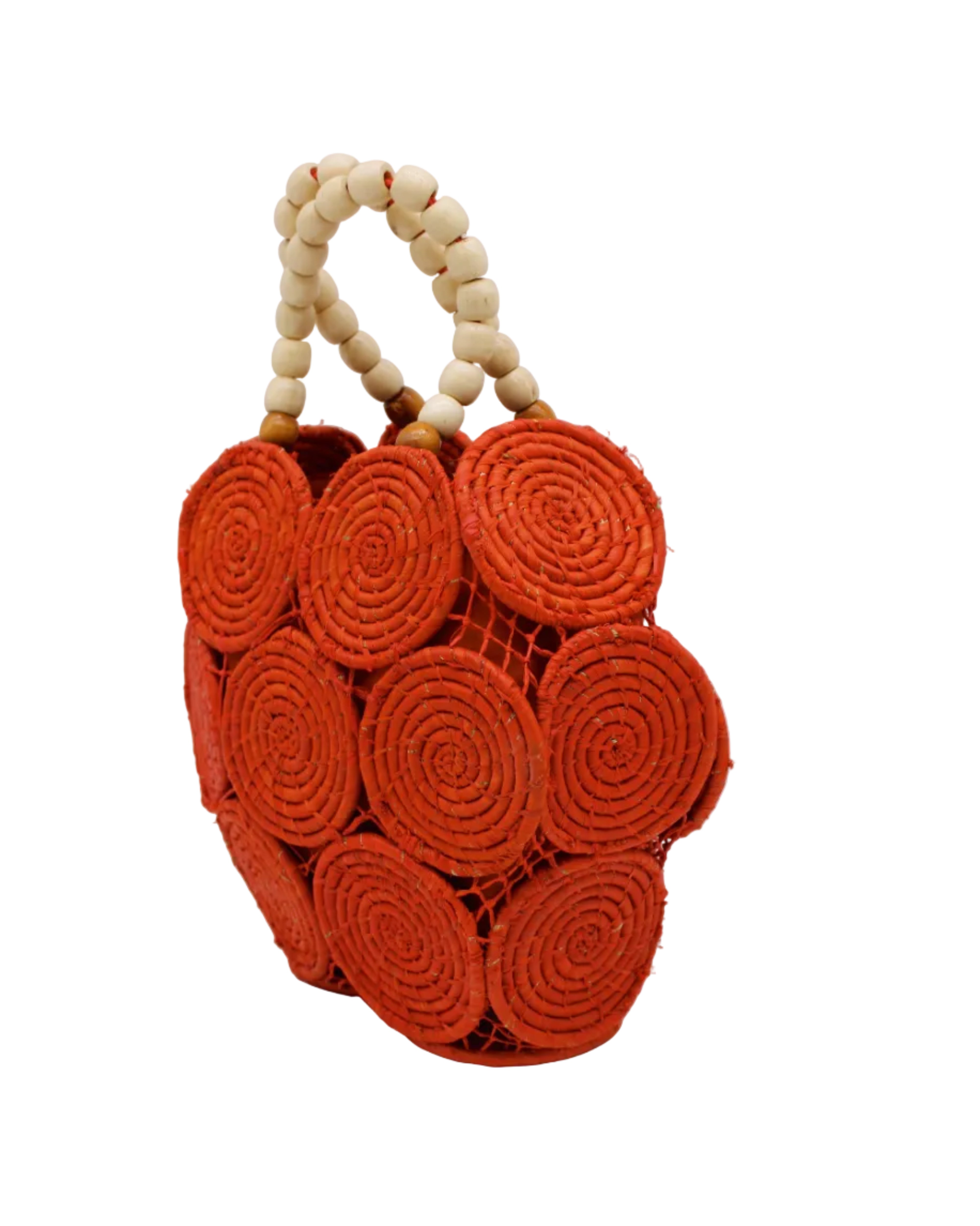 Side view Romy Coral Crochet Disc Straw Handbag with Wooden Bead Handles handmade natural raffia palm fiber in a solid hue of coral orange/red in a crochet coiled circular flat disc attached together with macrame knot technique with a geometric hexagonal overall shape with seven discs per side two above and below a horizontal row of three per side and a single row comprising the side of the bag with beige carved round wooden beaded handles purse - Shebobo