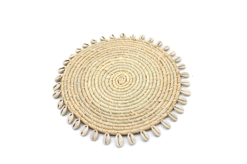 Detail view Round Crochet Natural Raffia Straw Placemats handmade woven raffia palm fiber in a solid hue of natural straw color with coiled loop texture discs with cowrie shell edge embellishment set of six - Shebobo