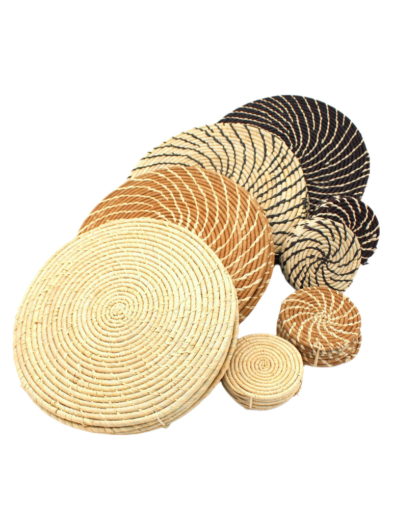 Round Two Tone Swirl Raffia Straw Coasters & Placemats Set of 6 handmade natural raffia palm fiber in a crochet loop disc technique creating concentric circular swirl pattern of texture with knotted spiral attachment sets of six placemats or coasters in multiple color options - Shebobo