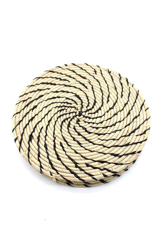 Round Two Tone Swirl Raffia Straw Coasters & Placemats Set of 6 handmade natural raffia palm fiber in a crochet loop disc technique creating concentric circular stripe pattern of texture in a solid hue of natural straw color with contrasting knotted spiral swirl weave in black sets of six placemats or coasters - Shebobo