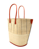 Side View Santa Cruz Two Tone Large Straw Tote Bag handmade beach bag loomed raffia solid natural straw color bottom with natural and black vertical pinstripe pattern top half plus leather handles xl handbag shoulder bag - Shebobo