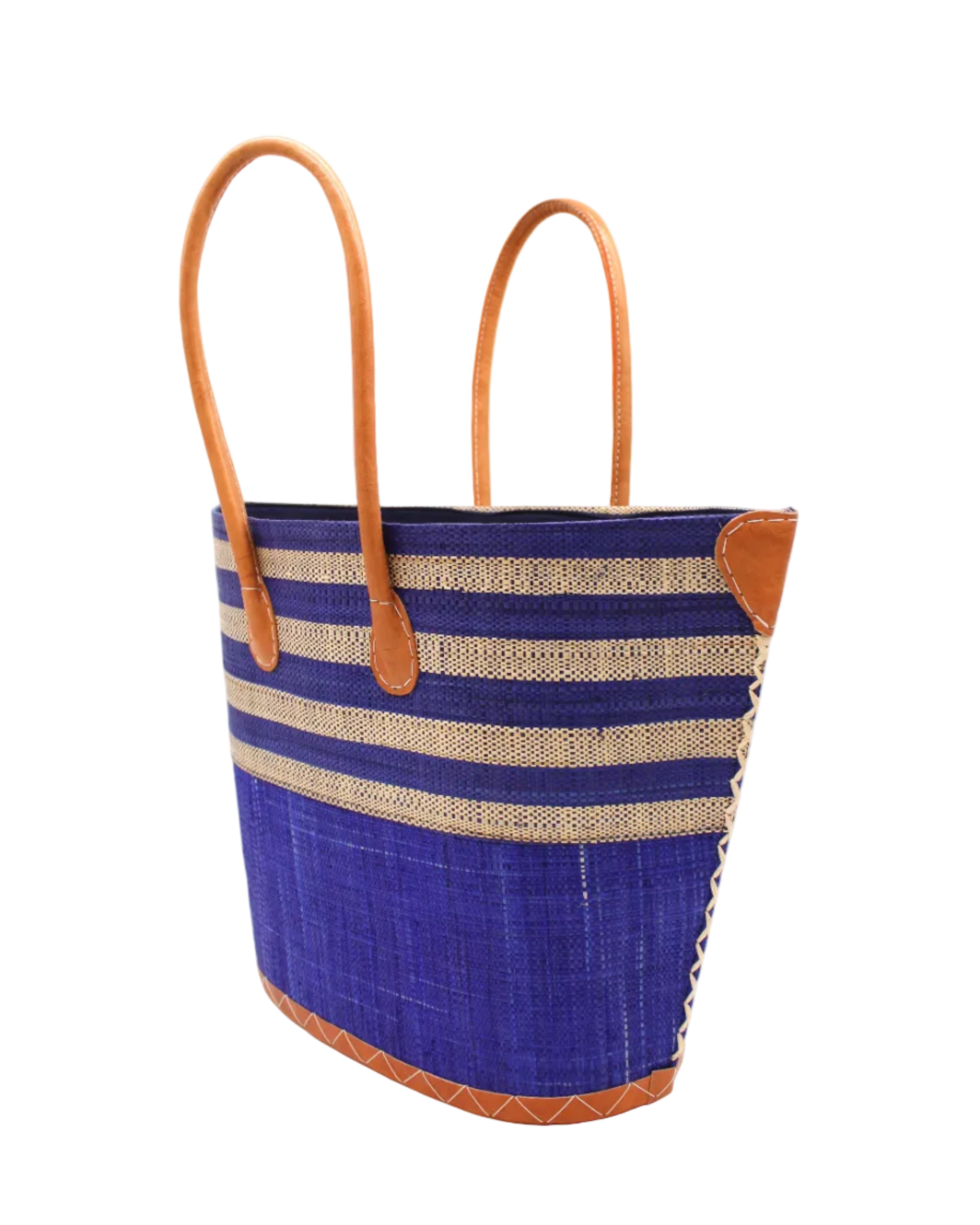 Side view Santa Cruz Dusk & Natural Two Tone Wide Stripe Small Straw Tote Bag handmade loomed natural raffia palm fiber in a two tone color block pattern of solid dusk navy/dark/blue on the bottom half of the bag and two tone even width horizontal stripes of dusk and natural straw color on the top half of the bag with leather handles and details beach bag handbag purse - Shebobo