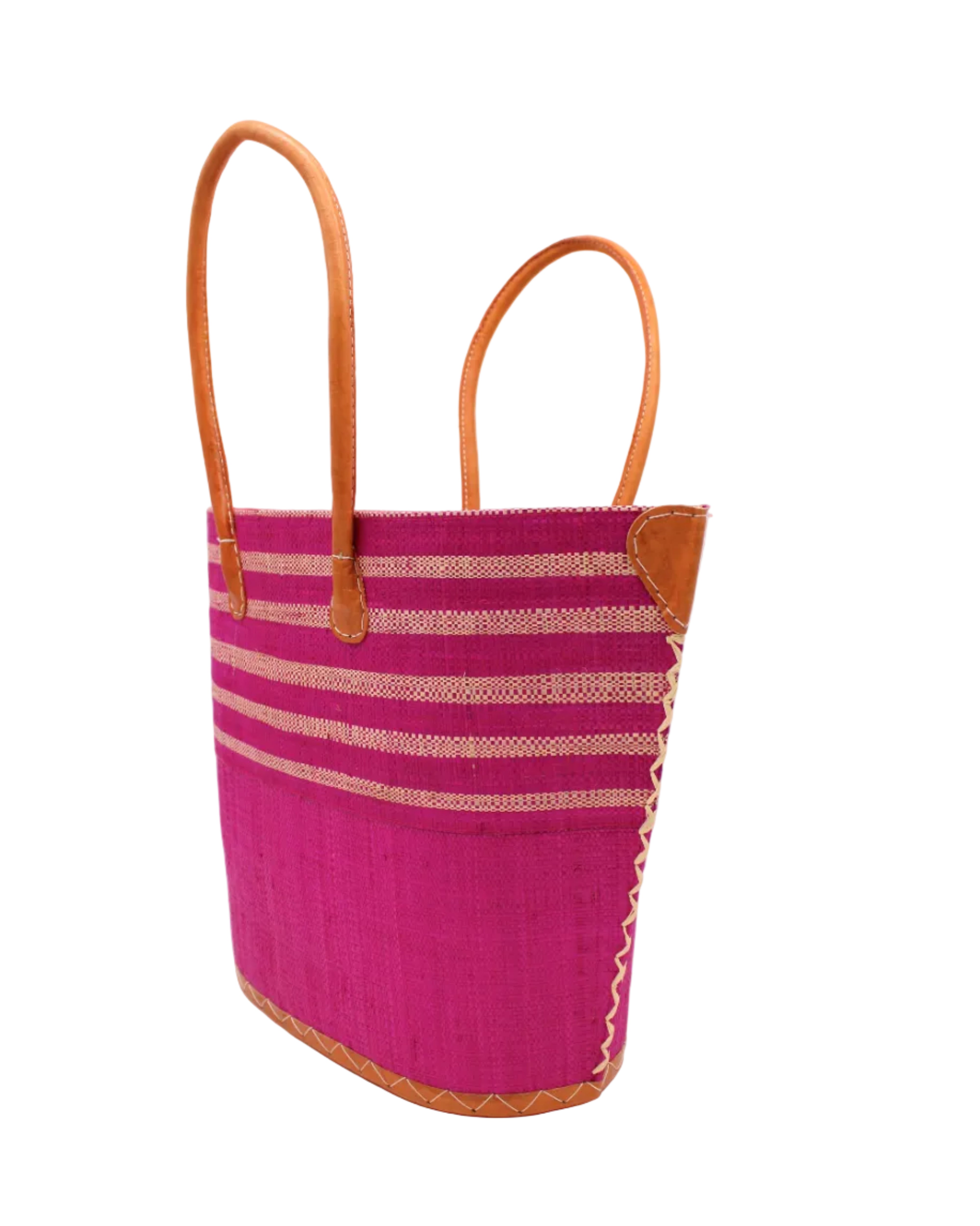 Side view Santa Cruz Fuchsia & Natural Two Tone Wide Stripe Small Straw Tote Bag handmade loomed natural raffia palm fiber in a two tone color block pattern of solid fuchsia hot/bright/barbie/pink on the bottom half of the bag and two tone even width horizontal stripes of fuchsia and natural straw color on the top half of the bag with leather handles and details beach bag handbag purse - Shebobo