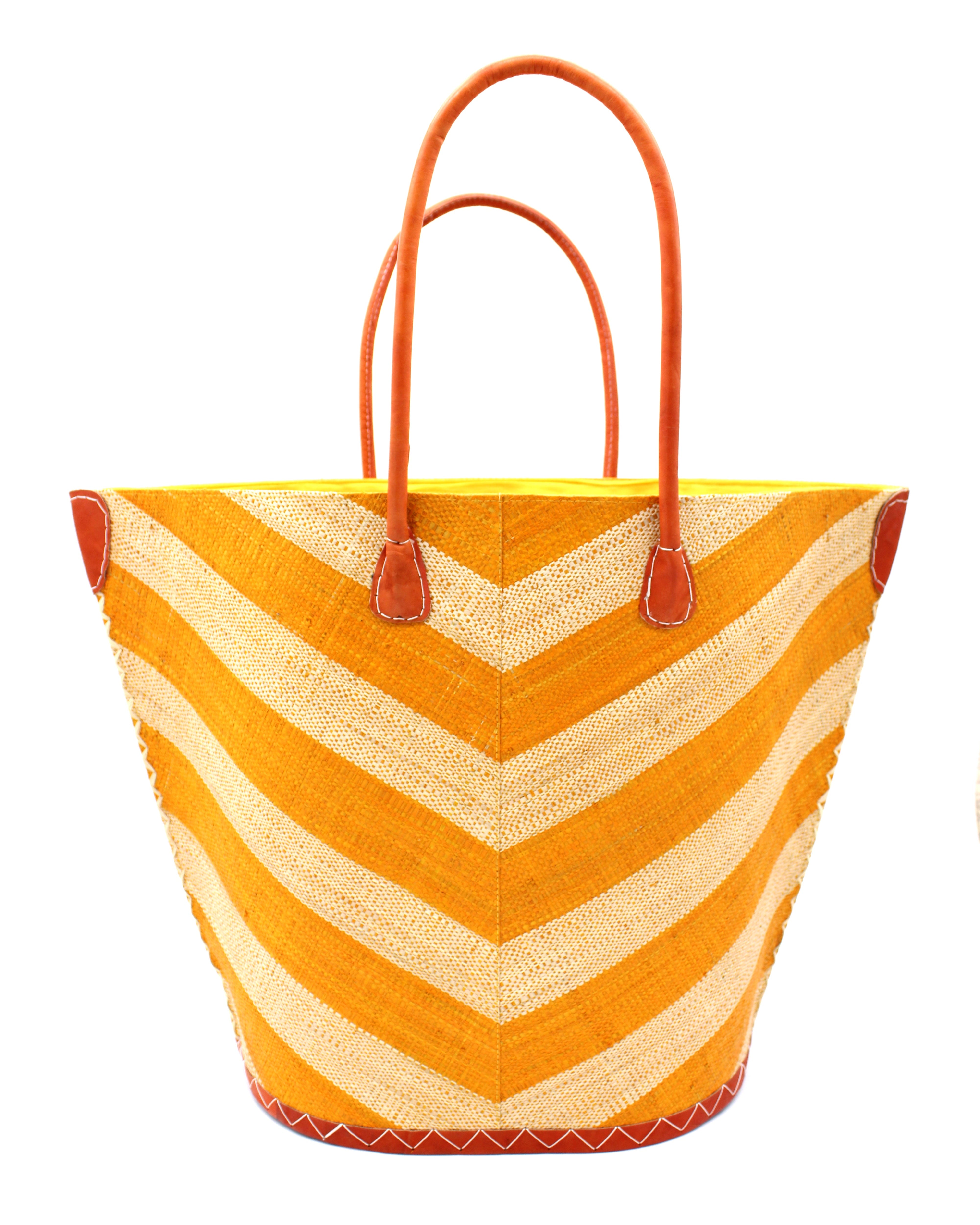 Santa Cruz Wide Stripe Chevron Large Straw Tote Bag handmade loomed raffia palm fiber in a two tone diagonal even width bands of color in a wide stripe chevron pattern of saffron orange/yellow and natural straw color on the front and a matching solid hue on the back with leather accents and handles large shoulder bag - Shebobo