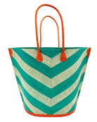 Santa Cruz Wide Stripe Chevron Large Straw Tote Bag handmade loomed raffia palm fiber in a two tone diagonal even width bands of color in a wide stripe chevron pattern of teal green/blue and natural straw color on the front and a matching solid hue on the back with leather accents and handles large shoulder bag - Shebobo