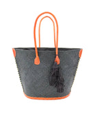 Santa Ynez Woven Small Straw Tote Bag with Tassel Charm Embellishment handmade woven raffia palm fiber in a solid hue of black with matching tassel tie charm embellishment and leather handles beach bag - Shebobo