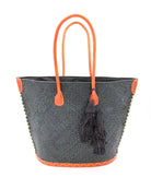 Santa Ynez Woven Small Straw Tote Bag with Tassel Charm Embellishment handmade woven raffia palm fiber in a solid hue of black with matching tassel tie charm embellishment and leather handles beach bag - Shebobo